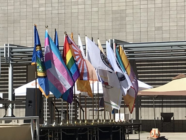 A group of flags on a podium.