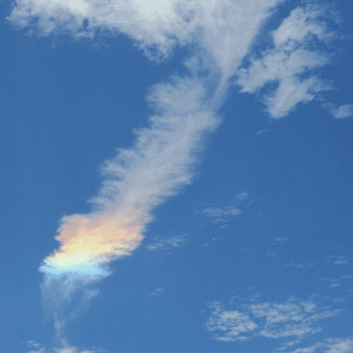 a cloud that looks like a feather with a rainbow tip.
